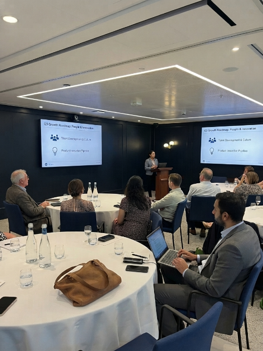 Total Ops boardroom session with a client leadership team reviewing an AI enquiry handling roadmap